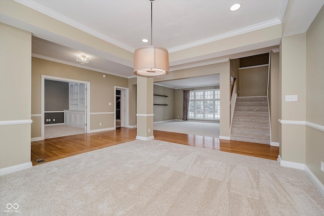 spare room with crown molding and carpet floors