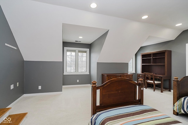 carpeted bedroom featuring lofted ceiling