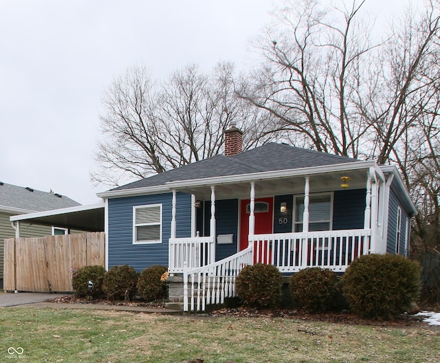 bungalow-style house with a front lawn and a porch