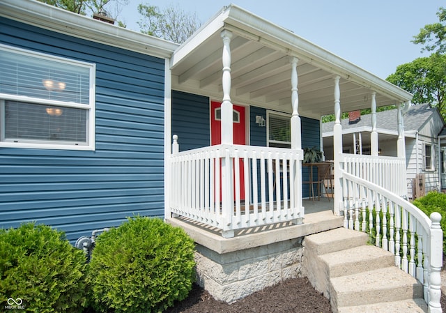 doorway to property featuring a porch