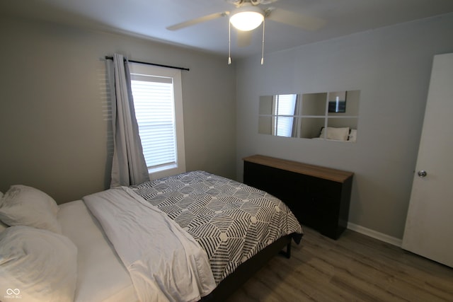 bedroom with hardwood / wood-style flooring and ceiling fan