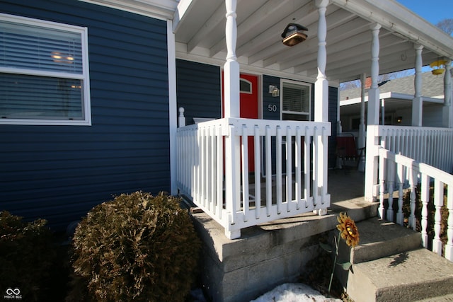 doorway to property with covered porch