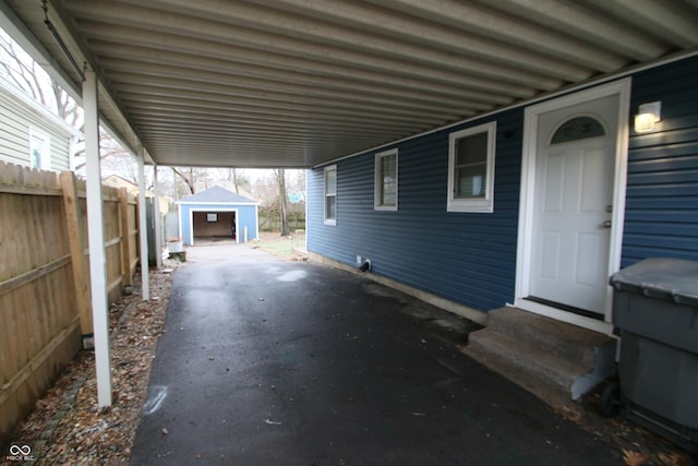 view of patio / terrace featuring a garage and an outdoor structure