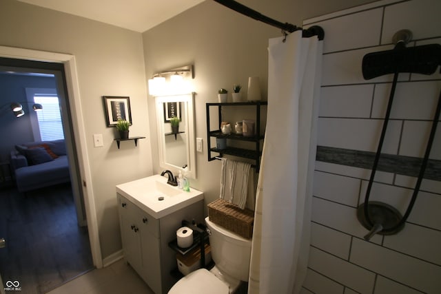 bathroom with toilet, a shower with curtain, and vanity