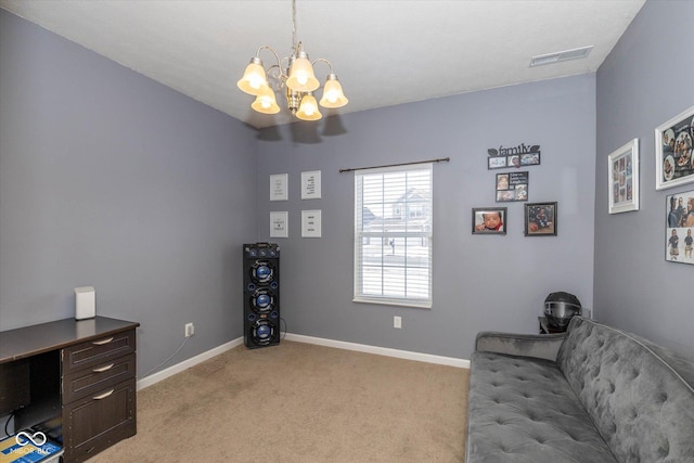 sitting room with light carpet and a notable chandelier