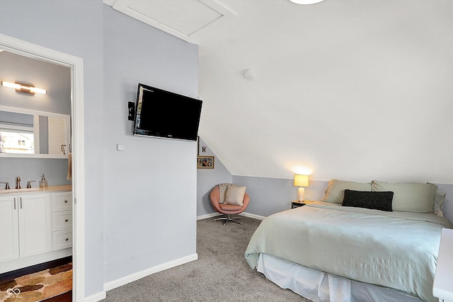 bedroom with light carpet, sink, and lofted ceiling