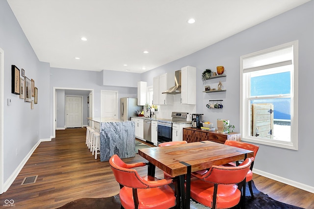 dining room featuring dark hardwood / wood-style flooring