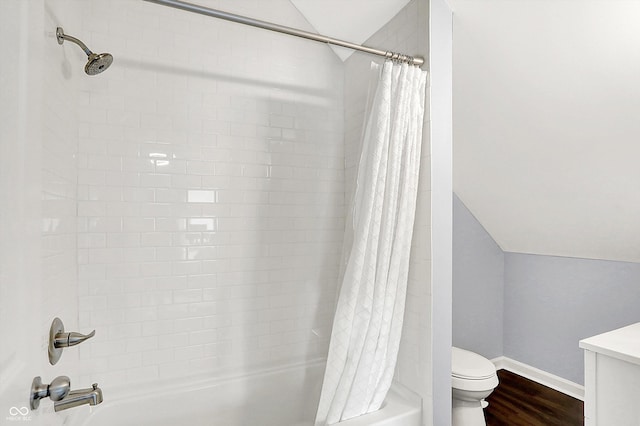 full bathroom with vanity, hardwood / wood-style floors, toilet, and shower / bath combo