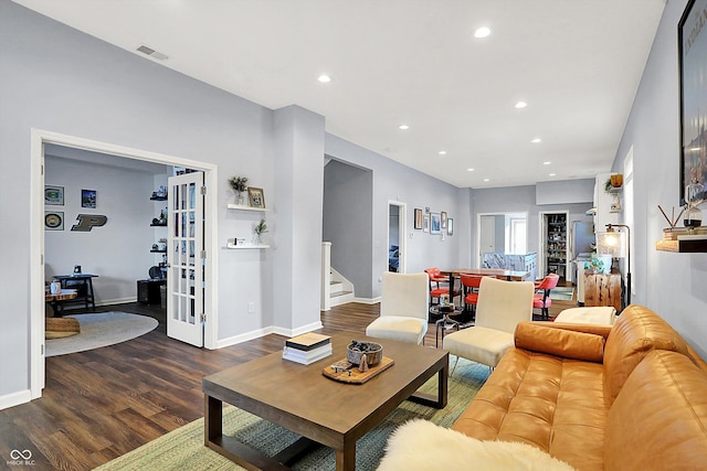 living room featuring dark wood-type flooring