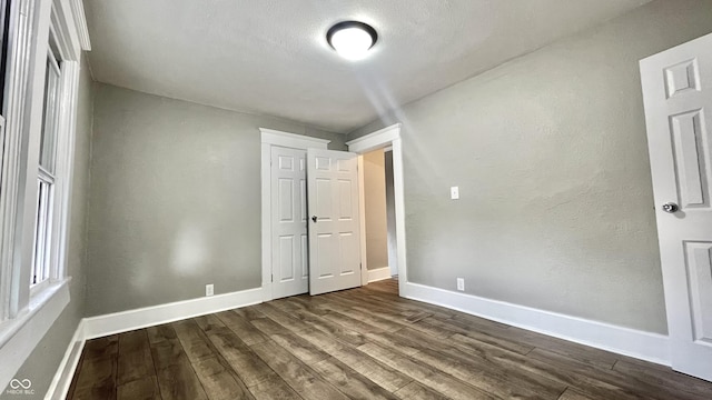 unfurnished bedroom featuring wood-type flooring