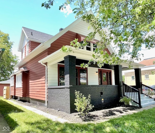 view of property exterior with a porch