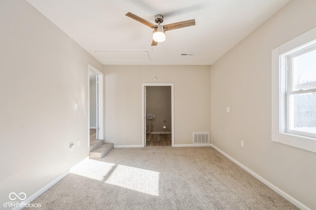 unfurnished room with light colored carpet