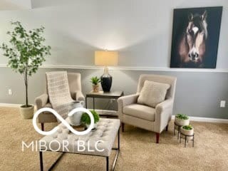 sitting room featuring carpet