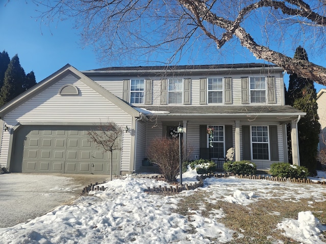 view of front of property featuring a garage and covered porch