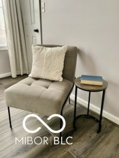 sitting room with hardwood / wood-style flooring