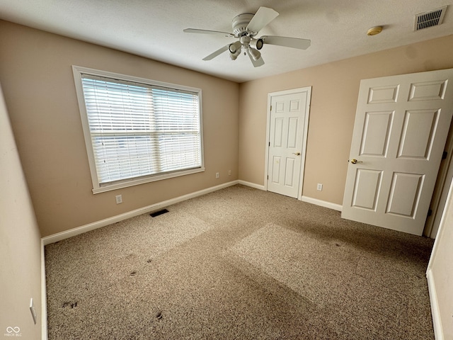 unfurnished bedroom with carpet and ceiling fan