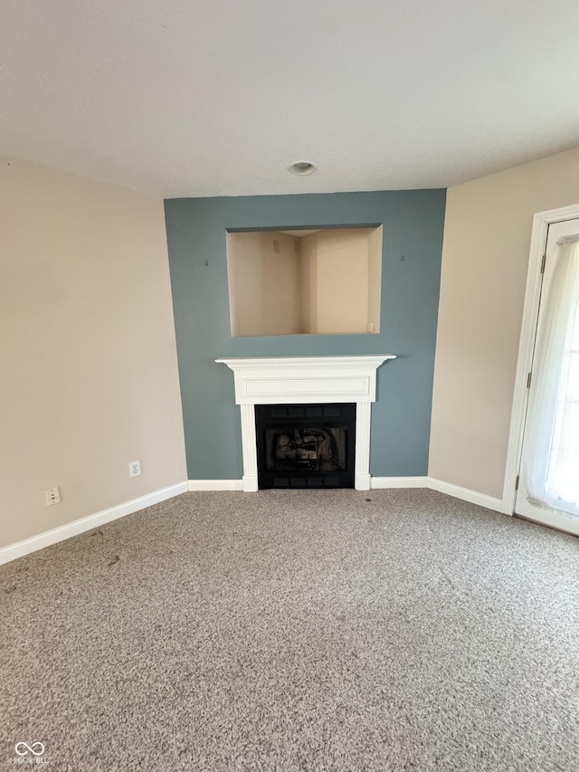 unfurnished living room with carpet