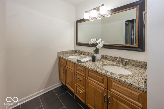 bathroom with tile patterned flooring and vanity