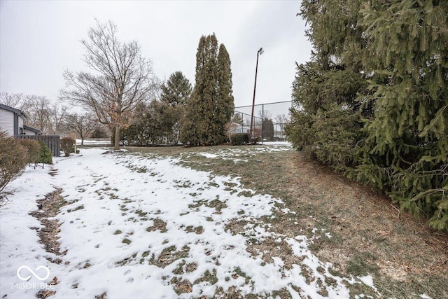 view of yard layered in snow