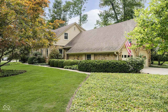 view of front facade with a front lawn and a garage