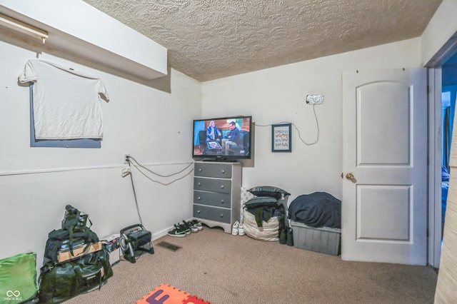 interior space featuring a textured ceiling