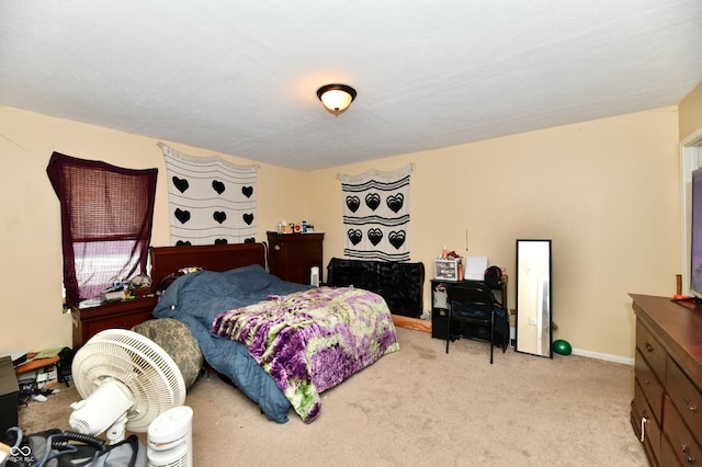 bedroom with light carpet