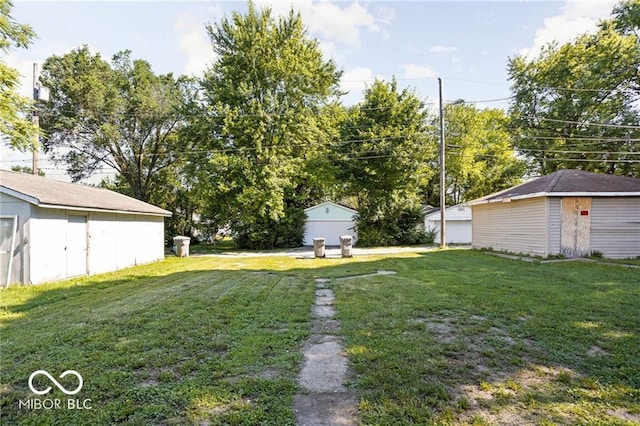 3614 E New York St, Indianapolis, IN 46201 - view of grassy yard with a shed