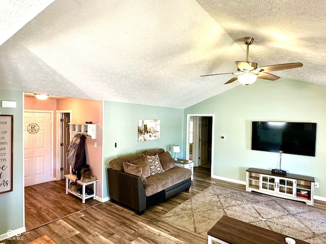 living room featuring dark hardwood / wood-style flooring, a textured ceiling, lofted ceiling, and ceiling fan