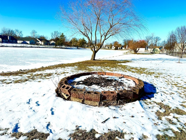 view of yard layered in snow