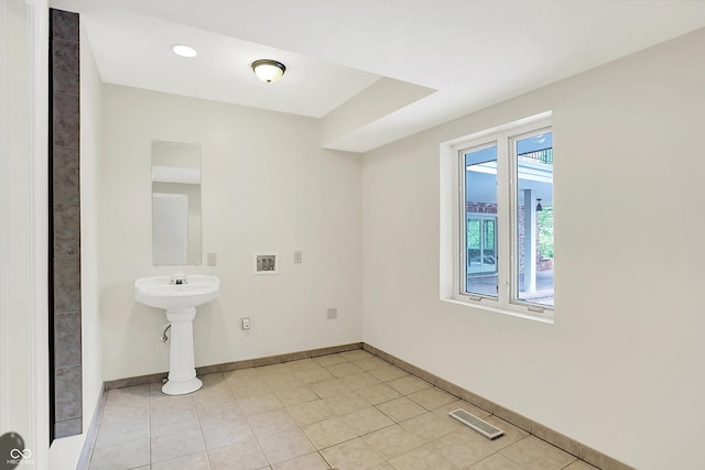 8602 Frontgate Ln, Indianapolis, IN 46256 - bathroom featuring baseboards and tile patterned flooring