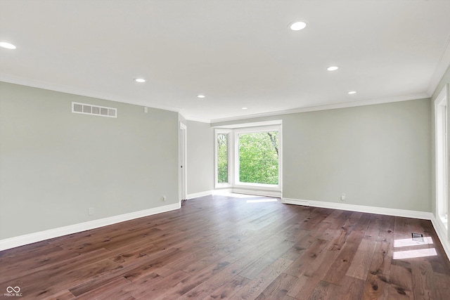 8602 Frontgate Ln, Indianapolis, IN 46256 - spare room featuring ornamental molding, dark wood-style floors, baseboards, and recessed lighting