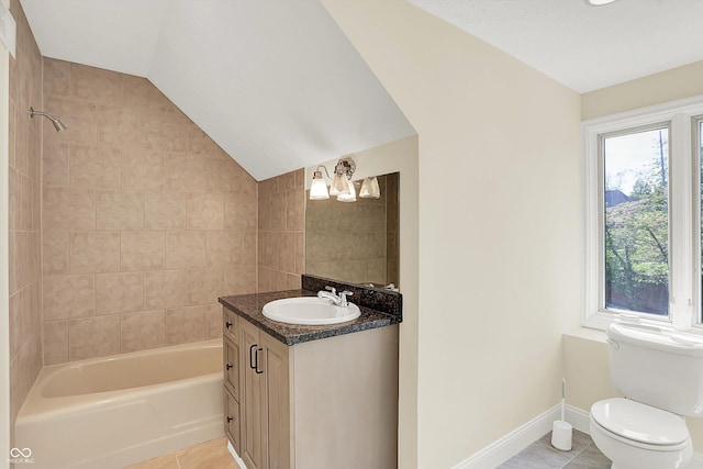 8602 Frontgate Ln, Indianapolis, IN 46256 - full bathroom with tile patterned floors, toilet, vanity, vaulted ceiling, and shower / tub combination