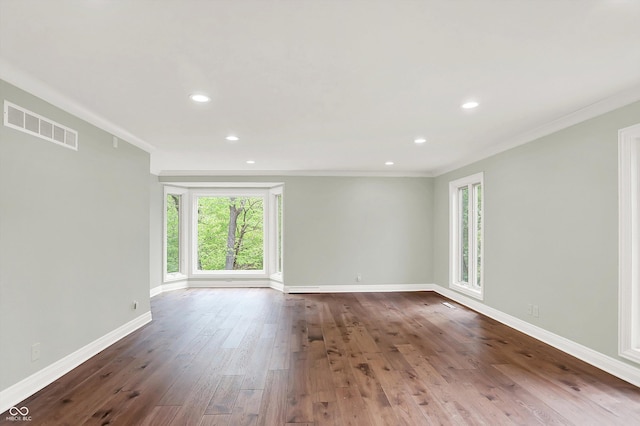 8602 Frontgate Ln, Indianapolis, IN 46256 - spare room featuring wood-type flooring, crown molding, baseboards, and recessed lighting