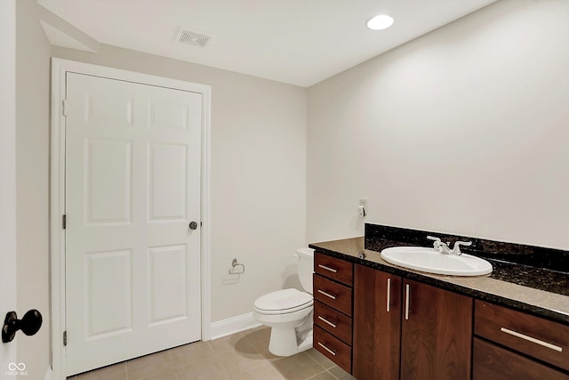 8602 Frontgate Ln, Indianapolis, IN 46256 - bathroom with toilet, vanity, baseboards, and tile patterned flooring