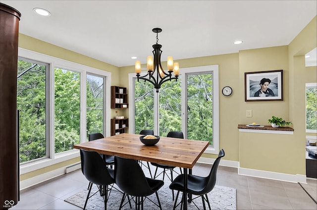 8602 Frontgate Ln, Indianapolis, IN 46256 - dining area featuring a baseboard radiator, a chandelier, light tile patterned floors, healthy amount of natural light, and recessed lighting