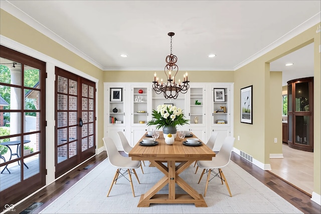 8602 Frontgate Ln, Indianapolis, IN 46256 - dining area with a chandelier, plenty of natural light, wood finished floors, crown molding, and recessed lighting