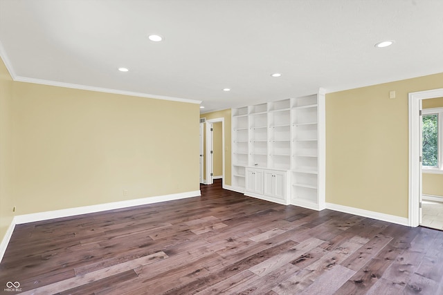8602 Frontgate Ln, Indianapolis, IN 46256 - empty room featuring wood finished floors, ornamental molding, baseboards, built in features, and recessed lighting