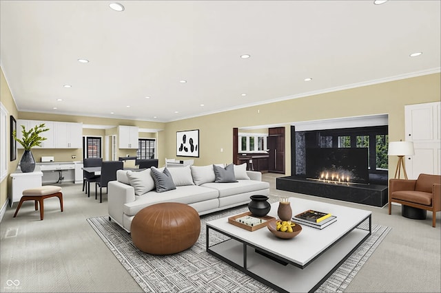 8602 Frontgate Ln, Indianapolis, IN 46256 - living area featuring light carpet, recessed lighting, a fireplace, and crown molding