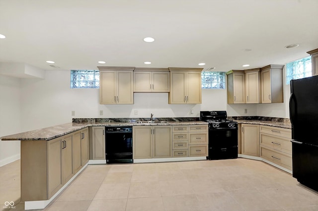 8602 Frontgate Ln, Indianapolis, IN 46256 - kitchen with black appliances, a peninsula, a sink, dark stone counters, and recessed lighting