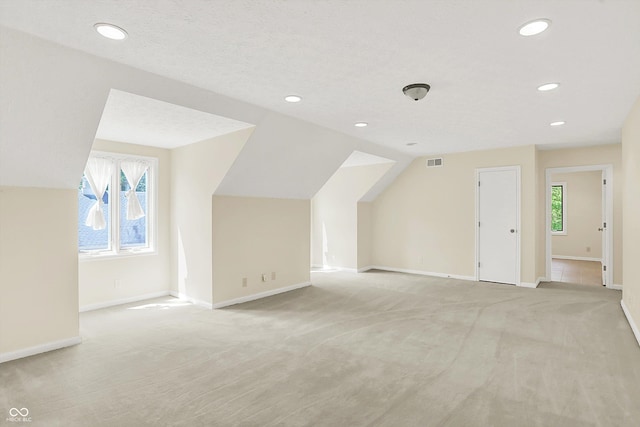 8602 Frontgate Ln, Indianapolis, IN 46256 - bonus room with light carpet, recessed lighting, baseboards, and lofted ceiling