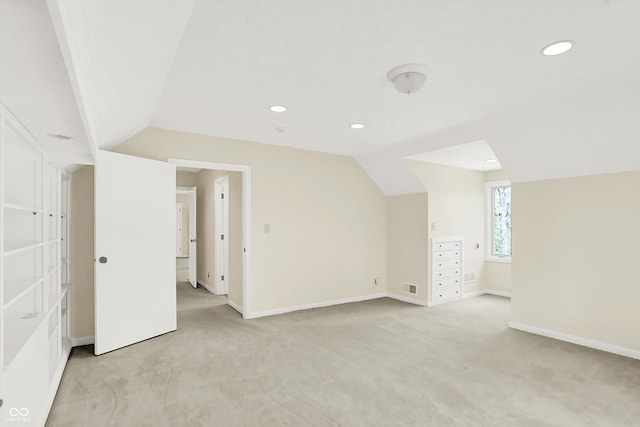 8602 Frontgate Ln, Indianapolis, IN 46256 - bonus room featuring light carpet, lofted ceiling, baseboards, and recessed lighting