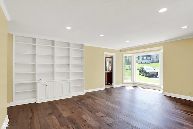 8602 Frontgate Ln, Indianapolis, IN 46256 - spare room featuring baseboards, dark wood finished floors, ornamental molding, recessed lighting, and built in shelves