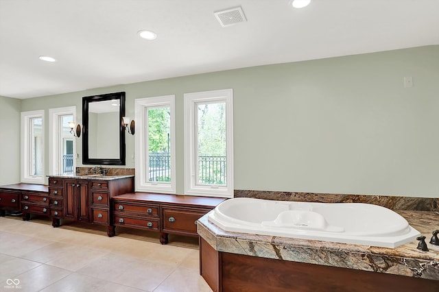8602 Frontgate Ln, Indianapolis, IN 46256 - bathroom featuring tile patterned floors, a bath, vanity, and recessed lighting