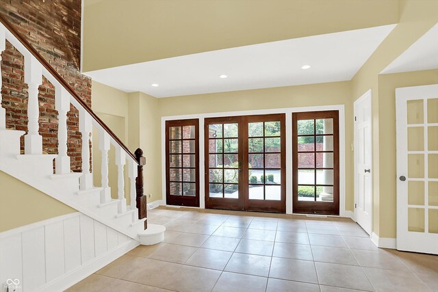 8602 Frontgate Ln, Indianapolis, IN 46256 - entryway with stairway, french doors, tile patterned flooring, and recessed lighting