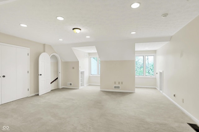 8602 Frontgate Ln, Indianapolis, IN 46256 - bonus room featuring light carpet, recessed lighting, and baseboards