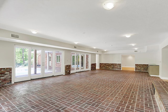 8602 Frontgate Ln, Indianapolis, IN 46256 - below grade area with brick flooring, baseboards, and french doors