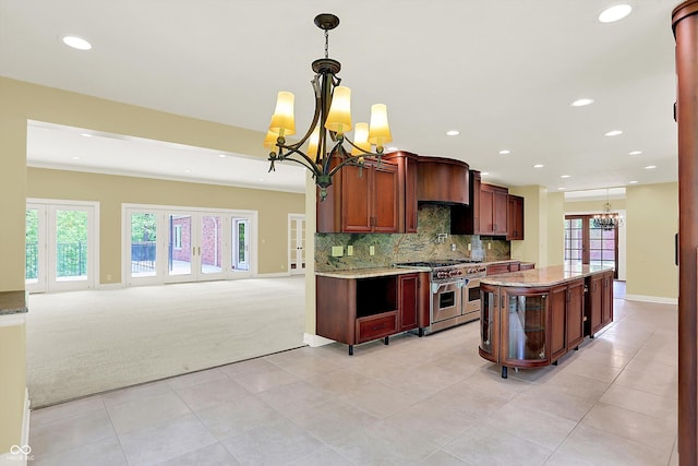 8602 Frontgate Ln, Indianapolis, IN 46256 - kitchen with a chandelier, double oven range, light carpet, recessed lighting, and light tile patterned flooring