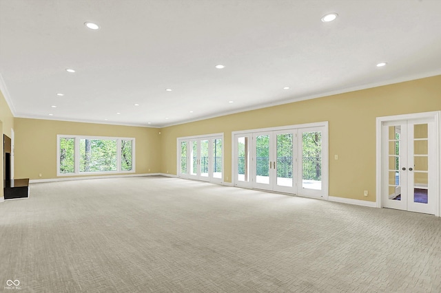 8602 Frontgate Ln, Indianapolis, IN 46256 - unfurnished living room featuring ornamental molding, light carpet, baseboards, french doors, and recessed lighting