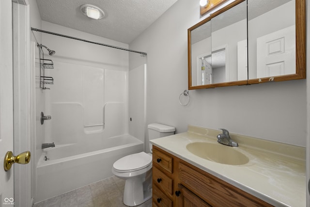 full bathroom featuring vanity, bathing tub / shower combination, toilet, and a textured ceiling