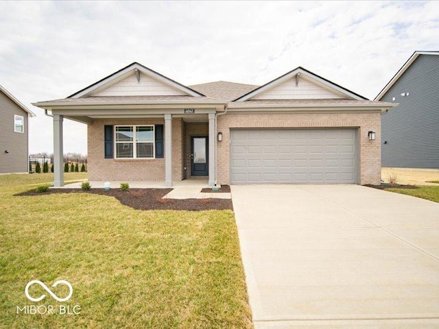 ranch-style home featuring driveway, a front yard, a garage, and brick siding